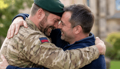 An emotional reunion between an Army veteran in military uniform and a stem cell donor, embracing warmly with smiles of gratitude and relief.